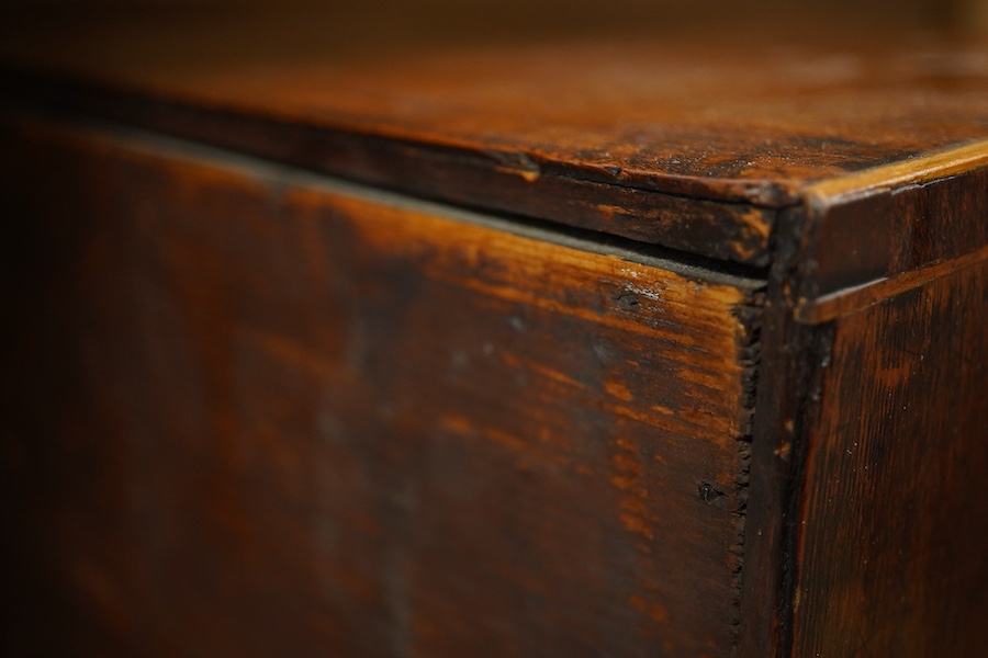 A George III mahogany miniature four drawer chest and key, 40cm high, 35.5cm wide. Condition - good